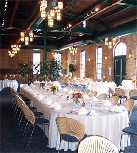 [image: Inside the Nicollet Island Pavillion--tables setup as they might be for a reception.]